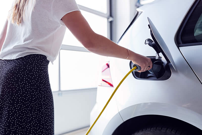 EV Charging woman charging car